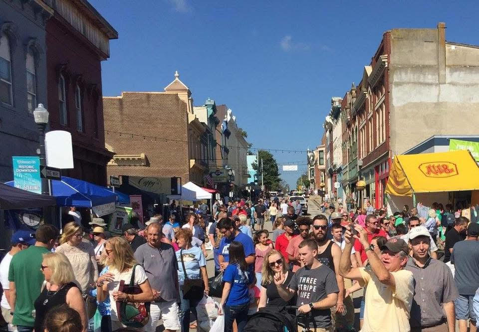 Photo of Court Day, with guests packing the street.